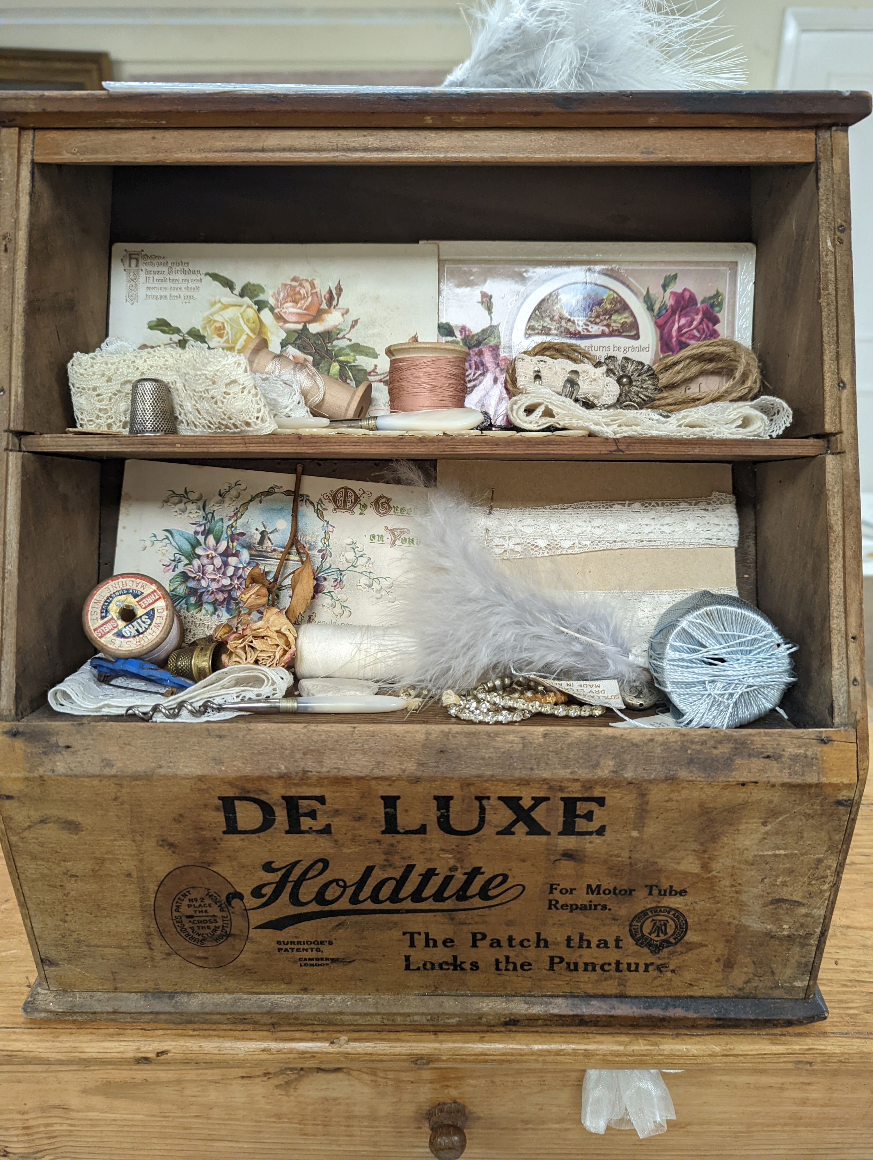 A 'Holdtite' shop cabinet and a pine three drawer chest, housing some costume jewellery